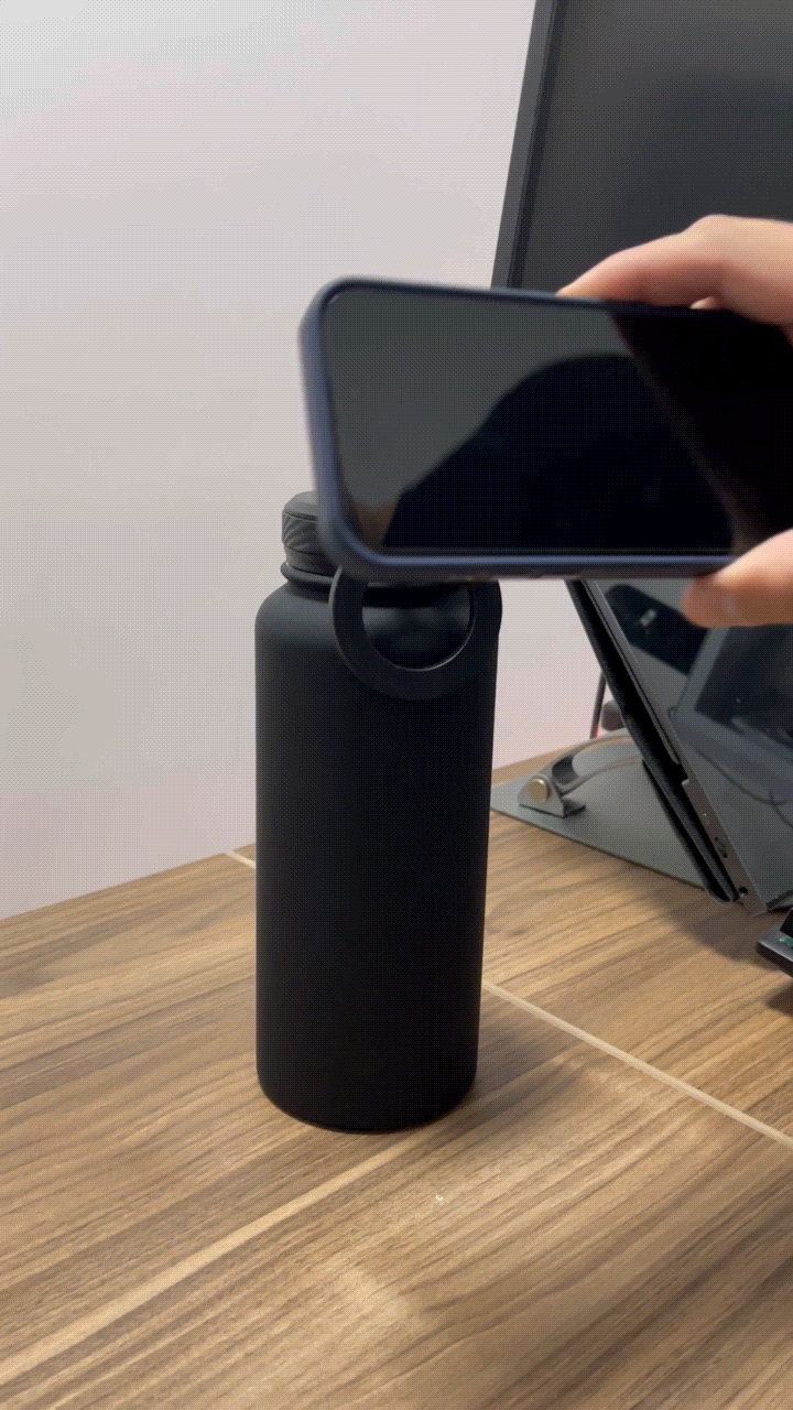 Magnetic Orbyt Bottle with phone attached β minimalist beige background.β
βOrbyt Bottle used at desk workstation.β
βHands-free recording setup with Orbyt magnetic bottle.β